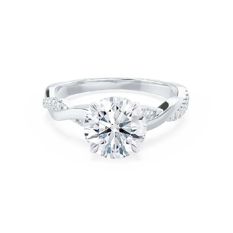 Halo diamond engagement ring in 18K white gold with a center oval - cut stoneEDEN - Moissanite & Diamond 18k White Gold Vine Solitaire