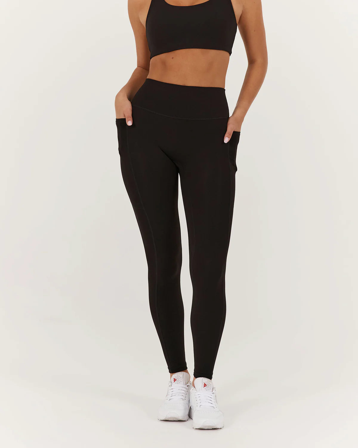 Women's High - Waisted Tight Trousers with Side Slits in Beige for a Trendy LookMuscle Republic | Motion Pocket Legging 28" - Black Women's High - Waisted Tight Trousers with Side Slits in Beige for a Trendy LookMuscle Republic | Motion Pocket Legging 28" - Black